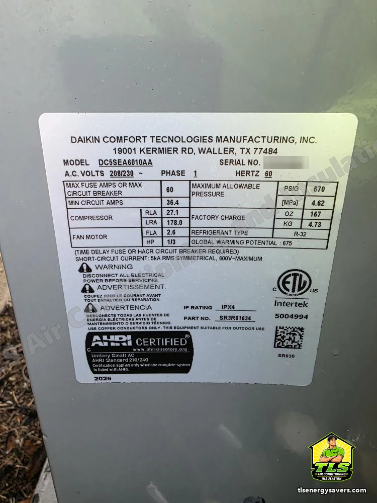 The Daikin condenser data plate showing R-32 refrigerant and 2025 AHRI certification, Riverview FL 33578