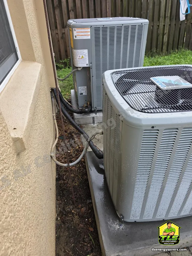 Both new outdoor condensers set on their pads at the side of the house, Riverview FL 33578