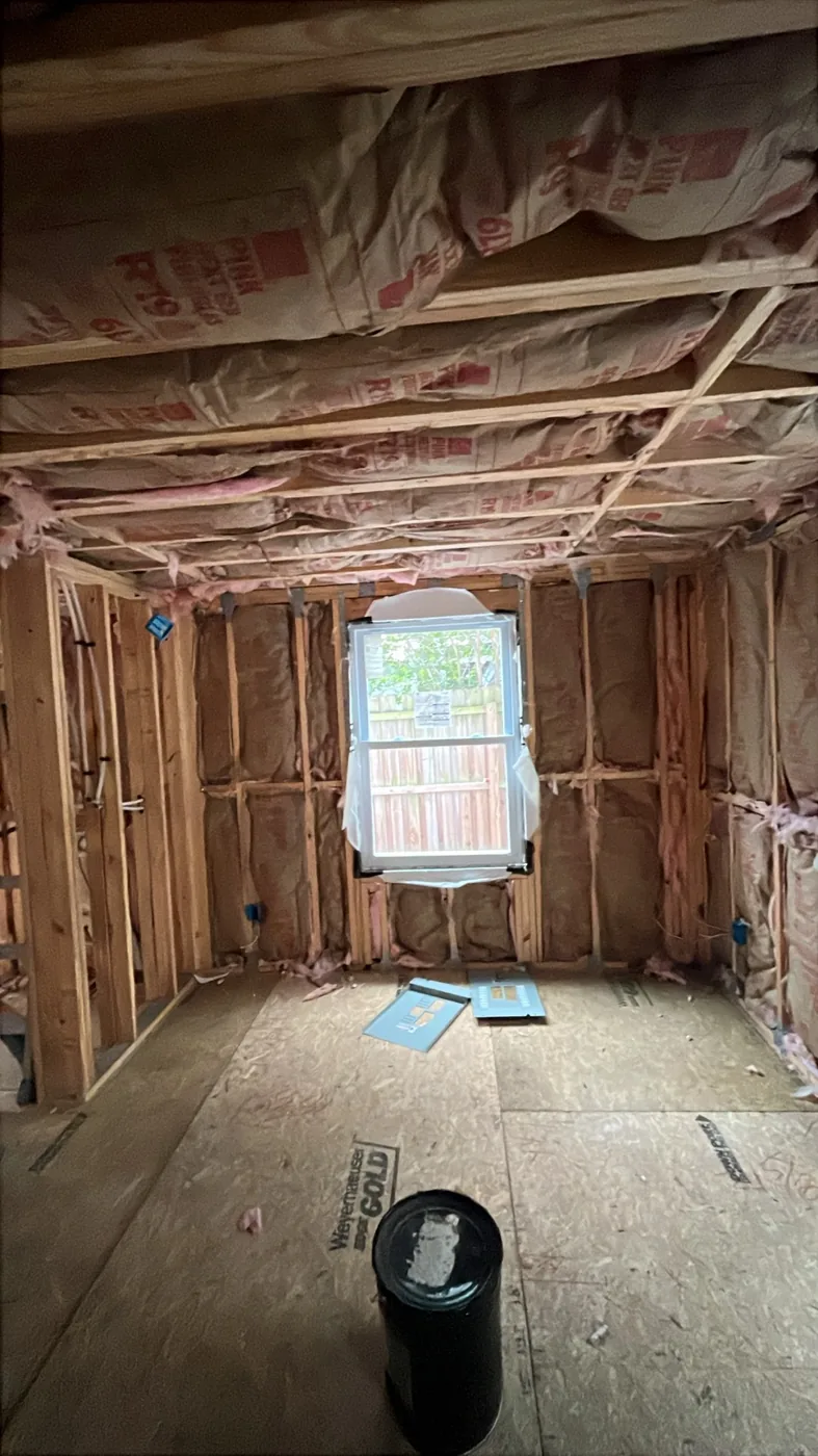 Bedroom with walls and ceiling joists fully insulated in kraft-faced fiberglass batts, Tampa FL 33609