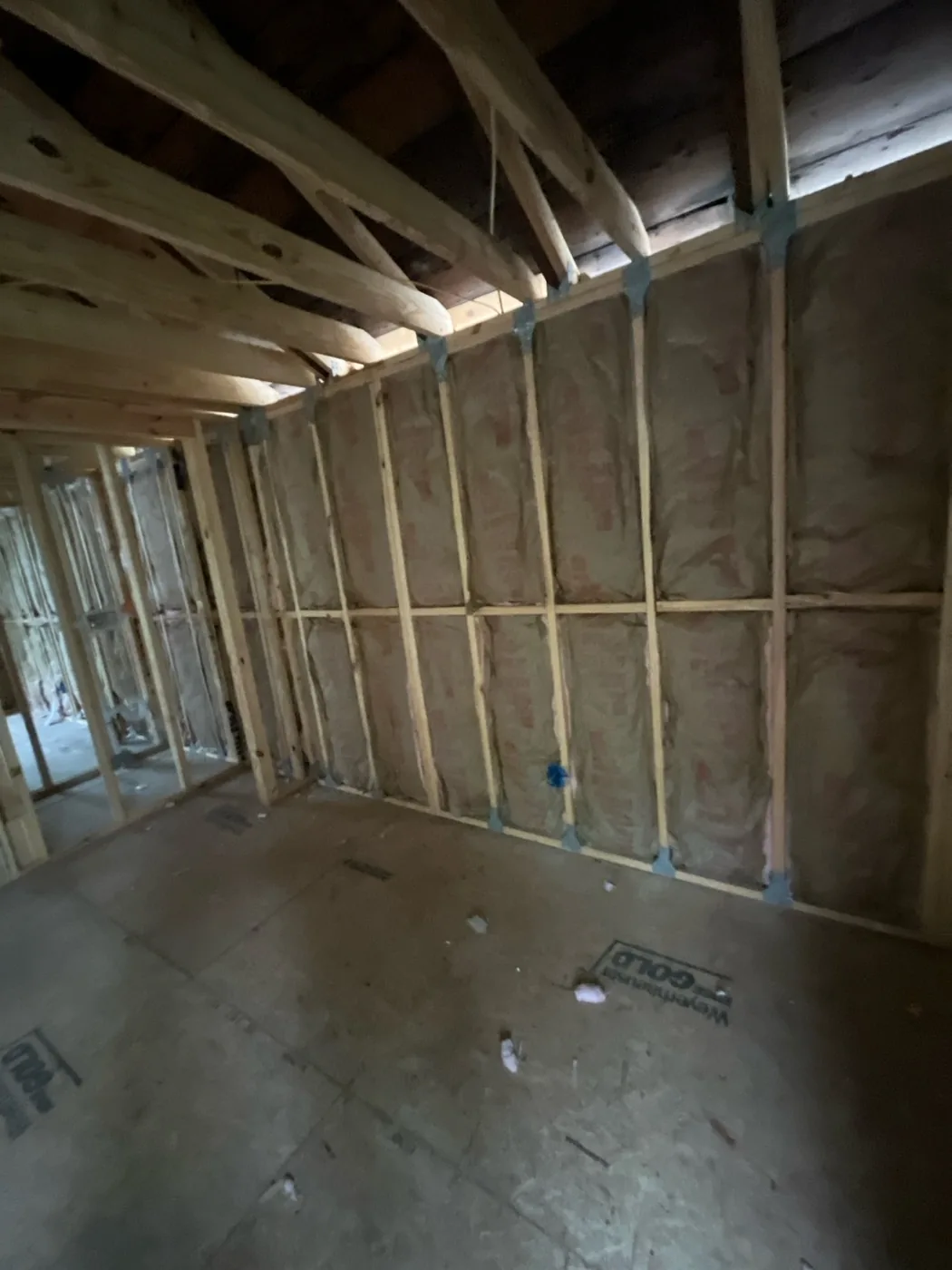 Second-storey knee wall insulated with kraft-faced fiberglass batts under the roof line, Tampa FL 33609