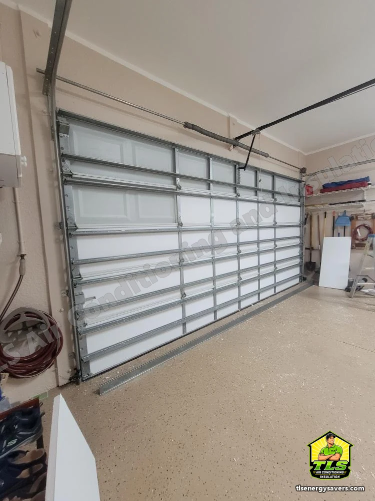 Rigid foam insulation panels being fitted into the garage door sections, Naples FL 34110