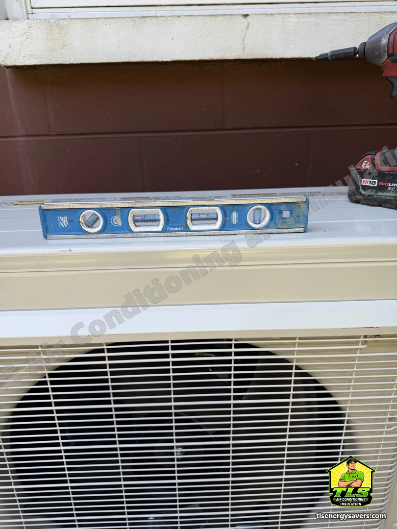 The new outdoor unit checked for level on its pad, Brooksville FL 34601